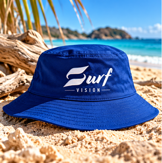 Surf Vision blue bucket hat on beach – styled promotional image
